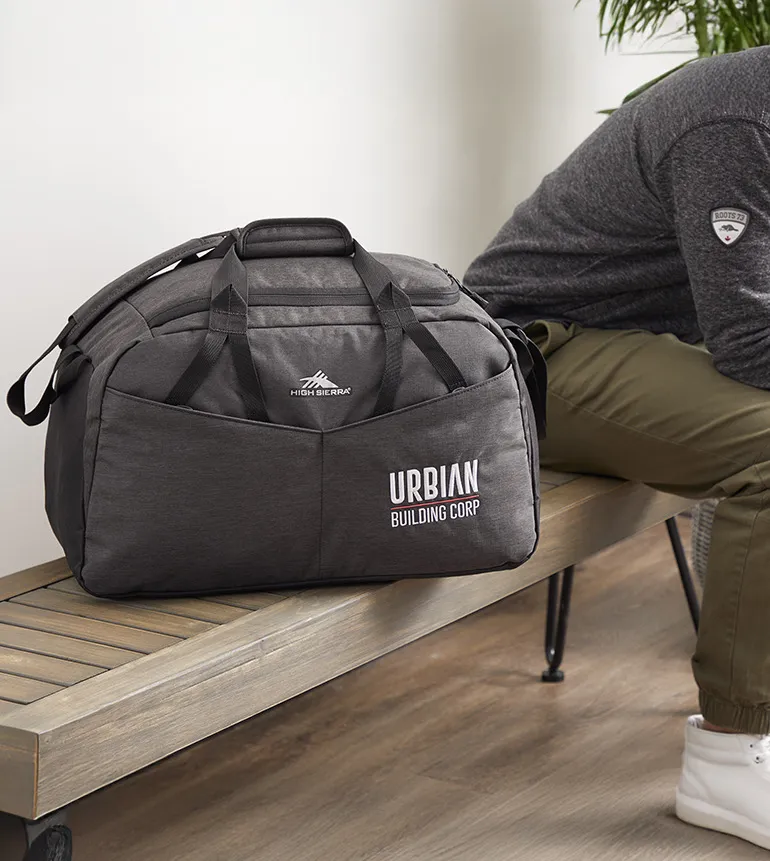 High-quality branded promotional products including premium tote bag, fleece, and desk items demonstrating long-term brand visibility and ROI
